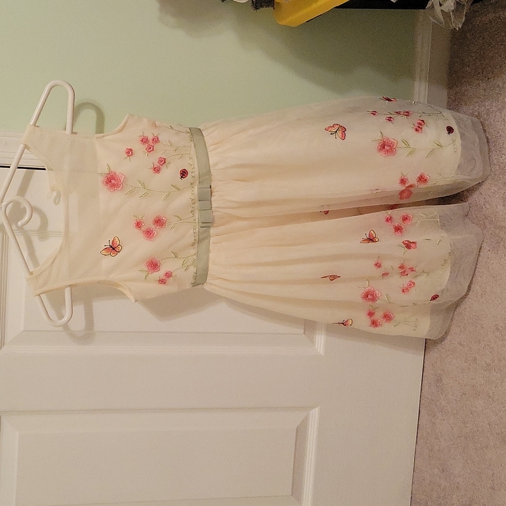 Girl dress with flowers and butterflies